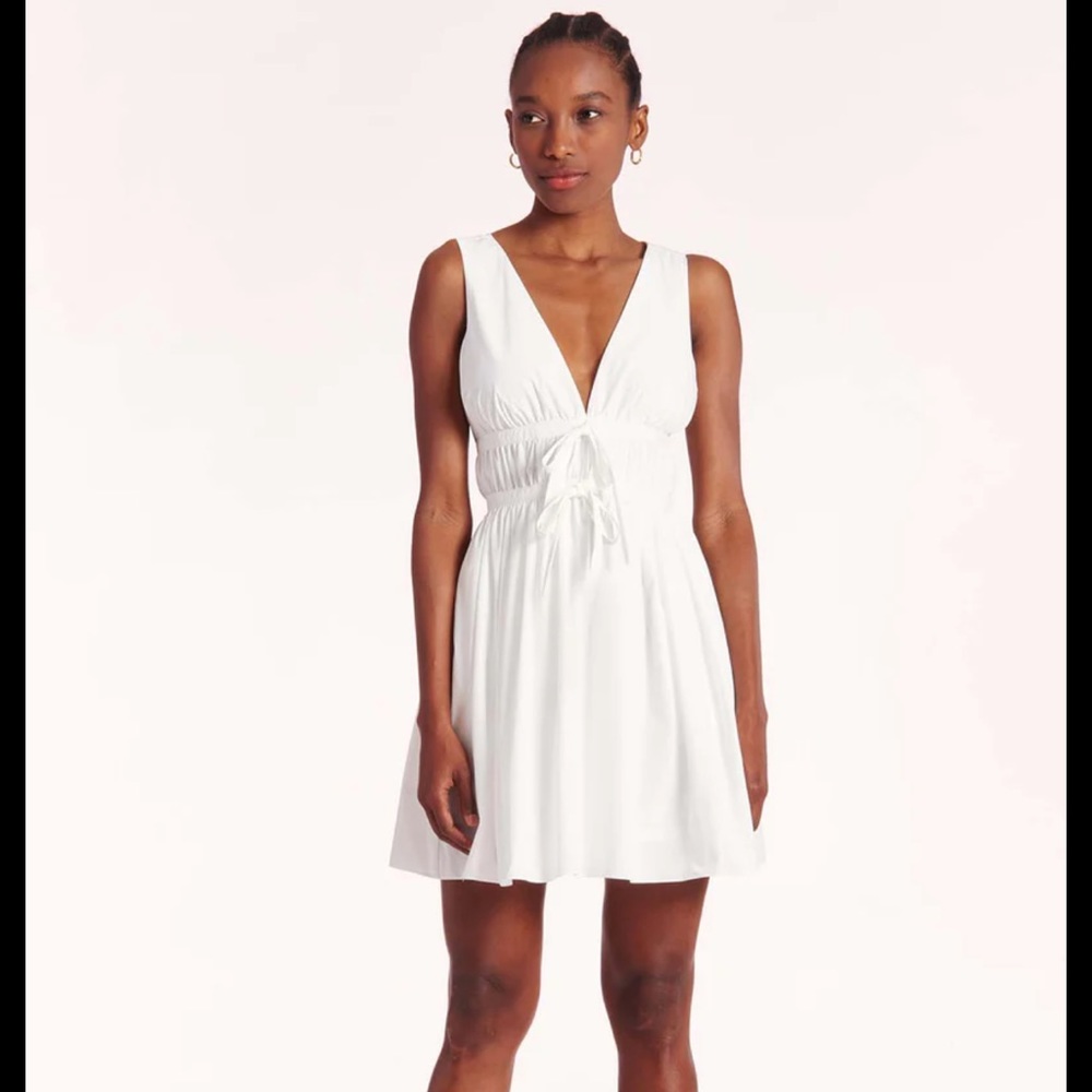Morello dress in white. Never worn. Red spot on dress. Haven’t tried to remove.